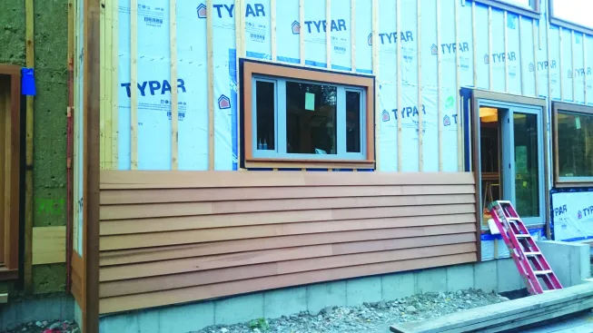 Closed vs. open rainscreen. Wood clapboards are an example of a closed rainscreen system, where each layer of cladding laps over the layer below.