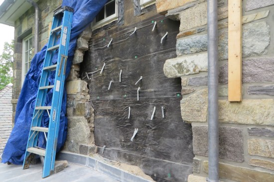 Installing proper through-wall flashing entailed having to remove the granitic stone veneer.
