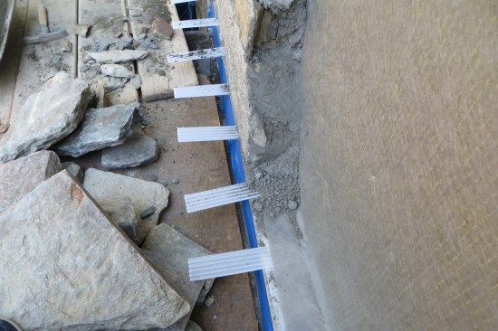 Self-spaced corrugated plastic weeps provided enhanced draining. The mortar is mixed up dry on site similar to the original mortar.