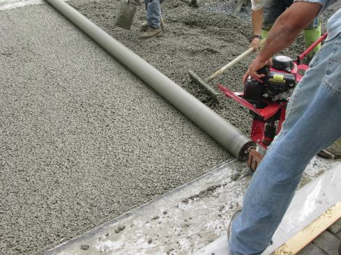 Running a steel vibratory roller over the driveway increases the density of the top couple of inches.