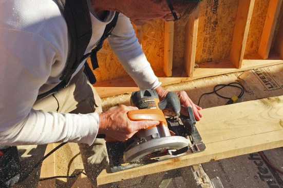 When making a bevel cut, use the alignment notch on the front to keep the saw aimed straight along the cut (above).