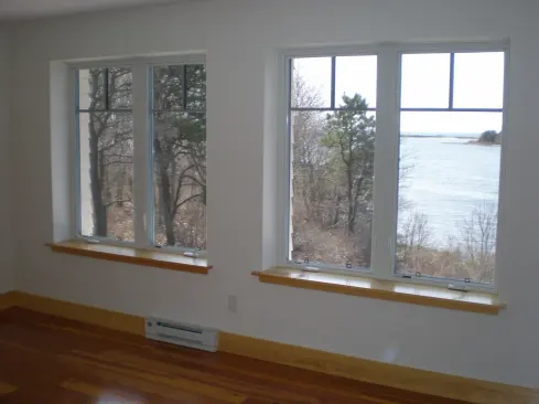 When a window is placed in the center of a thick wall, special attention needs to be paid to drainage on the outside.