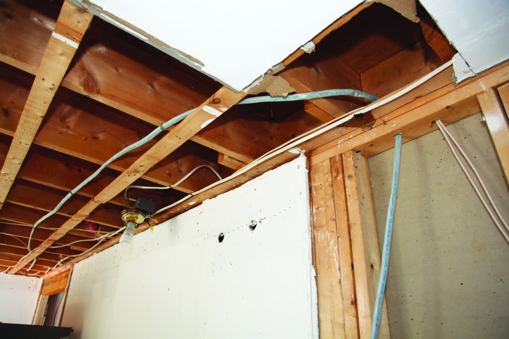 Floor joists resting on the wall plates are a good indicator of a load-bearing wall.