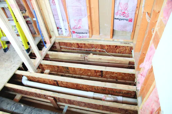 The joists in the larger, 3x5 shower ran parallel to the linear drain.