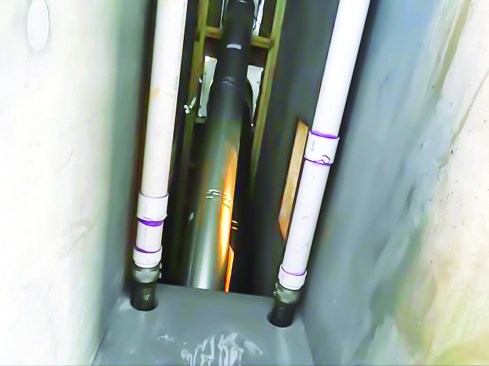 Vertical drains were routed through several concrete chimneys. Note the rubber sleeves connecting the PVC to the copper outlets at the gutter, and the transition to cast iron where drains run near living space