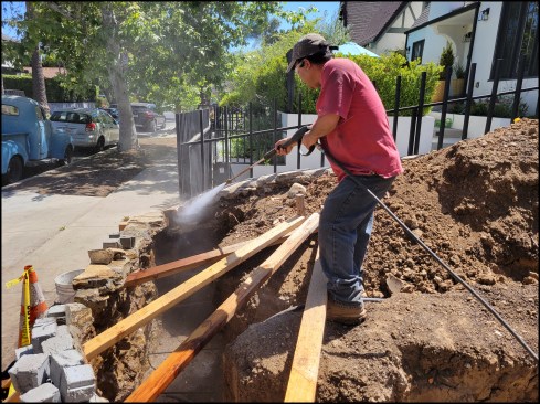 The interior side of the standing wall sections were pressure-washed to remove soil and debris.