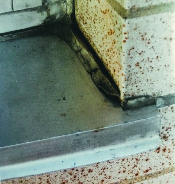 Water details in masonry buildings. Caulk alone doesn't work.