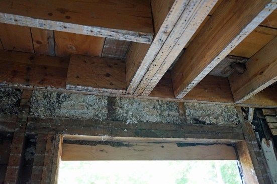 This flush beam in the second floor had no bearing on one end, only nails loaded in shear into a ledger.