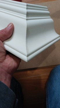 By gluing the outside miter on the ground before installing the crown, the author finds it easier to get a perfect fit.