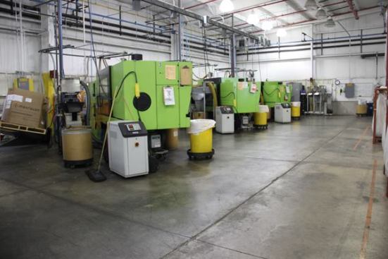 The injection machines shown here are in a separate building from the others and are being used to make push-in connectors and inline connectors. Wire can be joined by stripping the ends and shoving them into the holes in the connectors. The connectors are quick and easy to use and don’t take up much space in an electrical box.