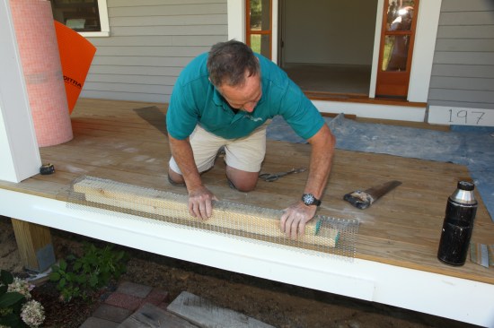 Instead of using cement board on the threshold, pre-form a sleeve of galvanized expanded metal by bending it over 2x4s. Pinch the legs of the metal in slightly so that the folded metal  grabs the threshold.