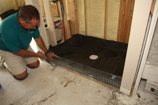 After slipping the mesh over the threshold, nail it from the outside only to hold it in place.