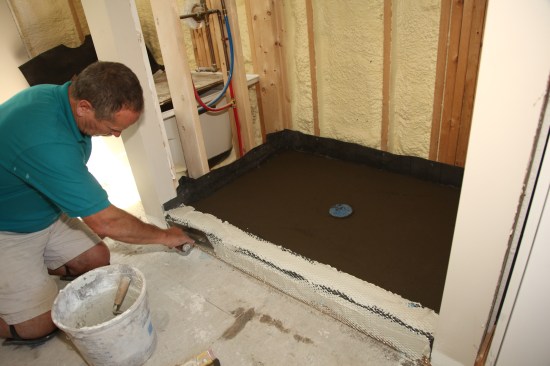 Coat the expanded metal with thinset to finish prepping the threshold.