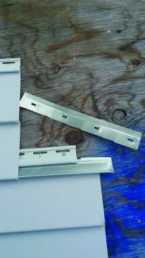 There are two different ways to reconnect separated panels. The first method is cutting a strip off a metal starter strip and inserting it into the lower locking strip to engage the separated panel at a lower level.