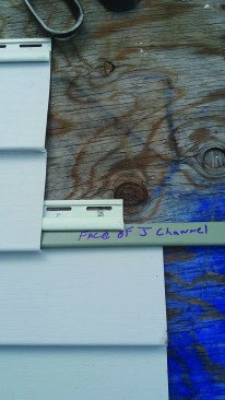 The second method is cutting the face off J-channel and inserting it into the locking strip of the lower panel.