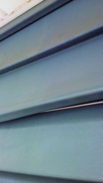 Here the separated panel is partially engaged with an added strip from a metal starter.