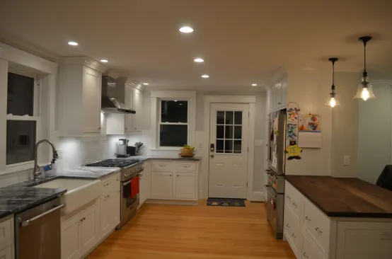 Recessed downlights are a common option for ambient kitchen lighting.
