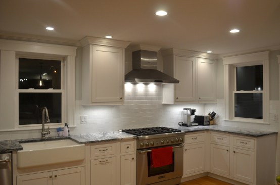 Downlights are placed in front of the cabinets in the ceiling.