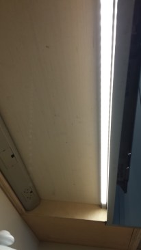 Under-cabinet lights hide behind a light rail