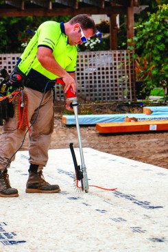 A stand-up screw gun takes longer to drive each fastener, but is just as fast for the job overall.