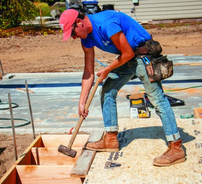 A sledgehammer and block drive the sheets together.
