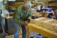 The bottom roller hardware is the last part to attach to the ladder.