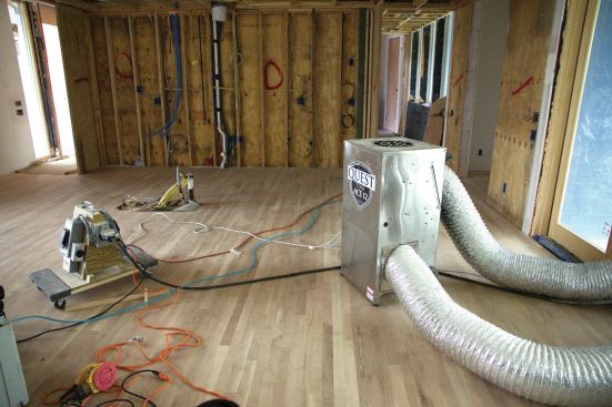Bringing the permanent HVAC system online while dust is still being created would cause equipment failure down the line. Instead, portable units such as this Quest Cool ACS 12 are used to condition the interior.