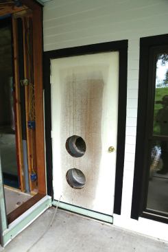 Another option for routing the AC ducts outside is a temporary swing door with cutouts.