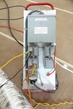 The heaters are plugged into temporary power centers that the author's electricians wire up.