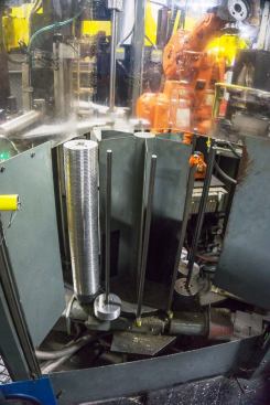 This “rotisserie” holds a stack of the forged steel plates (the flat end that connects to the arbor) that will be welded onto blades. They are stacked in this manner so a robotic arm can pick them up, position them, and hand them to the robot that does the welding.