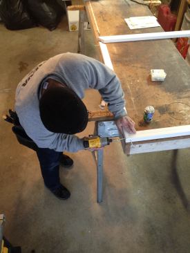 Before coming to the site to do the installation, Manny cut and preassembled the exterior molding for the window in the comfort of his shop. To join the PVC molding, he glued and screwed the corners.