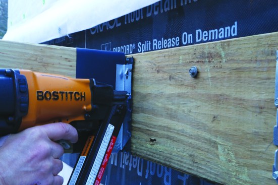 Bostitch’s pneumatic nailer exposes the nail tip, which is placed in the hole before the gun is fired. Placement is critical since a misfire can damage the joist hanger or send a nail hurling back towards the operator.