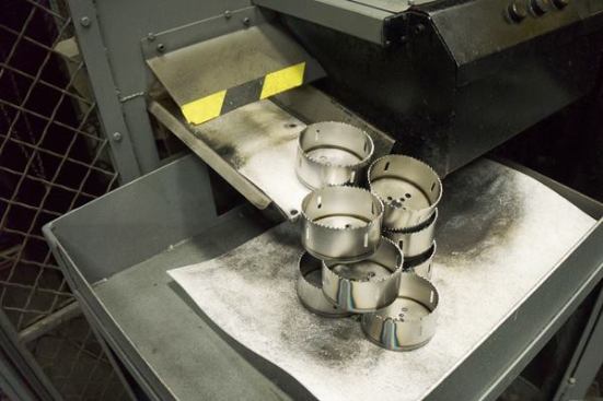 After the pieces are welded together, they are dropped into a trough to cool.
