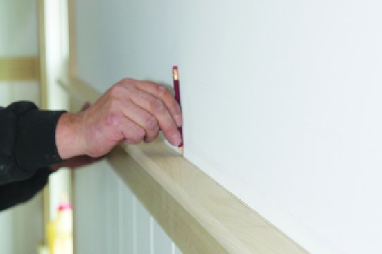 For small, straight line gaps, make the scribe using a pencil that rides on the surface that you are fitting to.