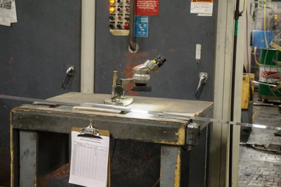 This old school microscope is used to spot check the quality of the weld.