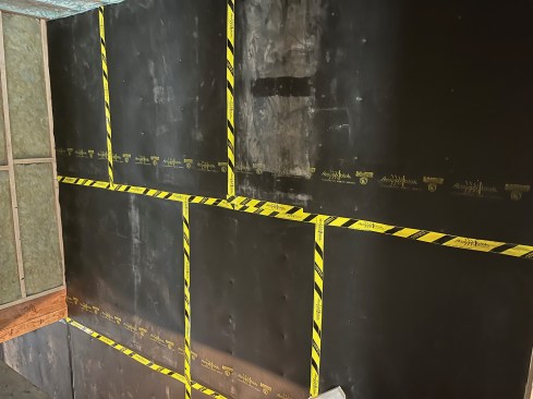 MLV sheets taped off before the 5/8-inch drywall is installed. 