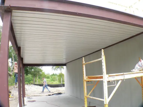 The porch slab cures for about 28 days, after which the shoring can be removed, and finish materials applied to the steel frame.