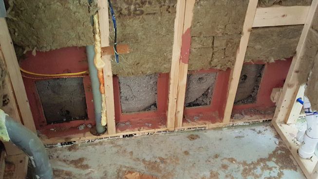 Another view of the exposed wall system during water damage remediation, the day after the flood occurred.
