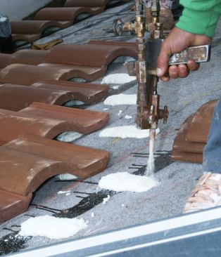 In the field, only the foam is used to avoid screw holes in the newly applied hot-mopped underlayment.