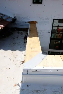 Anytime we have a 90 degree turn in a cap I want a good membrane at these critical junctions. Tyvek Flexwrap is what I use.