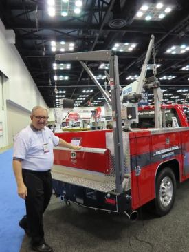 Western Mule is one of a number of companies that make cranes that fold into the bumper when not in use. This is their A-Series crane. Models are available to lift between 750 and 2,500 pounds.
Click here for video of how the crane works.