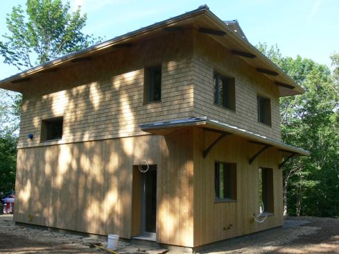 This small but elegant home in Camden, Maine, was designed and built by Belfast, Maine, Passive House builder EcoCor in collaboration with the owners. The Passive House envelope was completed using EcoCor's trademark panelizing system, but the homeowners took over at the painting and trim stage.