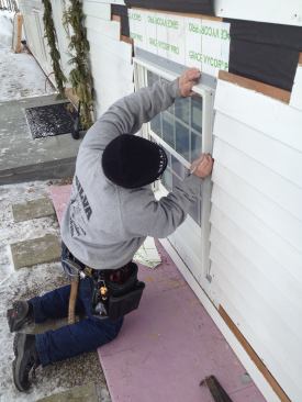 Before applying the flashing tape to the side jambs, Manny scribes a line about 1/2 inch from the corner of the nailing flange. Starting the tape along this line will help keep it straight as it is applied.