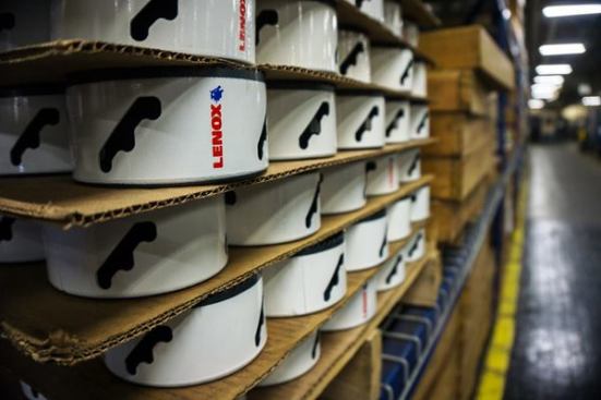 These finished hole saws have been stacked and are awaiting shipping. The shelves that contain them seem to go on for miles.