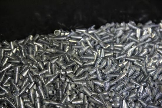 These cone-shaped springs were made in another part of the factory. They will be installed in the plastic bodies shown in earlier photos and are what keep wires from coming out of the connectors.
