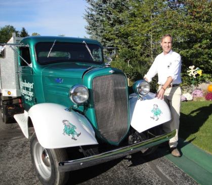 Gow Litzenburger poses with his oldest truck, “Pixie”, a 1934 Chevrolet JC series one-ton pickup.