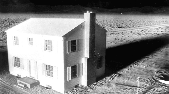 A nuclear device destroys a test house in March 17, 1953, at Yucca Flat at the Nevada Proving Ground. (Photo by Department of Defense)