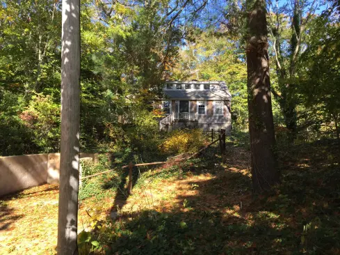 The original house on the property was beyond salvaging, and at 15 feet higher than the street, it posed an accessibility challenge for the aging clients.