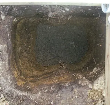 This provides a good base for the footing, which consists of 6 inches of concrete to tie all the rock together and an additional 6 inches for anchoring the tube form.
