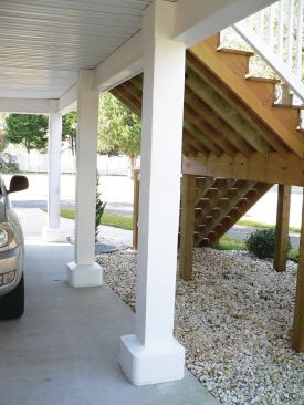 Because the steel columns supporting the deck at ground level are in a flood plain, the author wrapped them with masonry block finished with stucco.